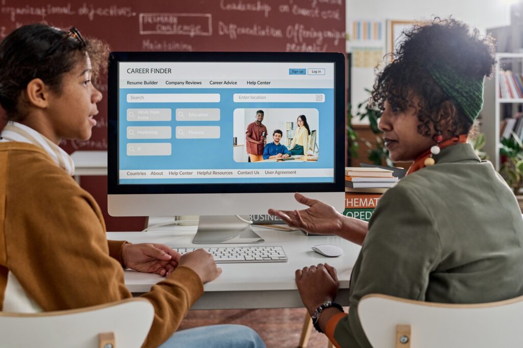 Two Black Students Discussing Career Opportunities in Class